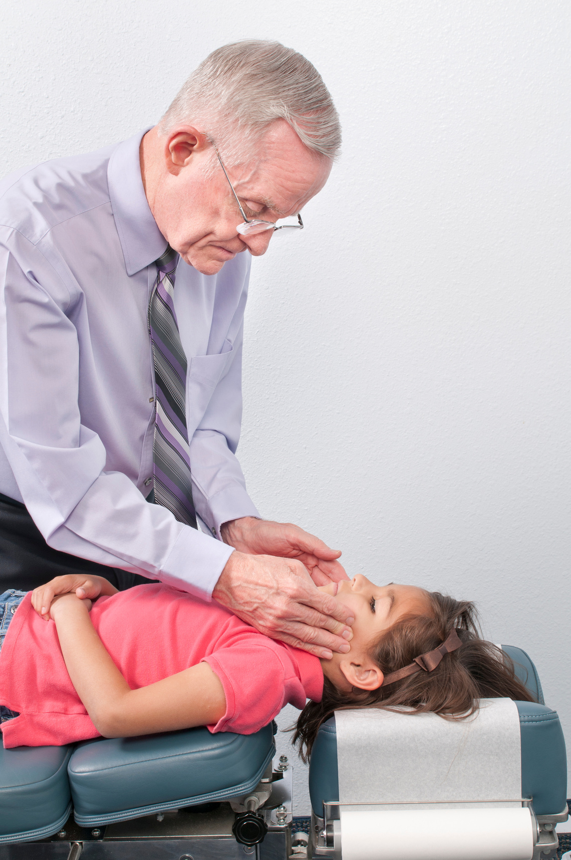 Chiropractic Doctor Tests Jaw of Child for TMJ
